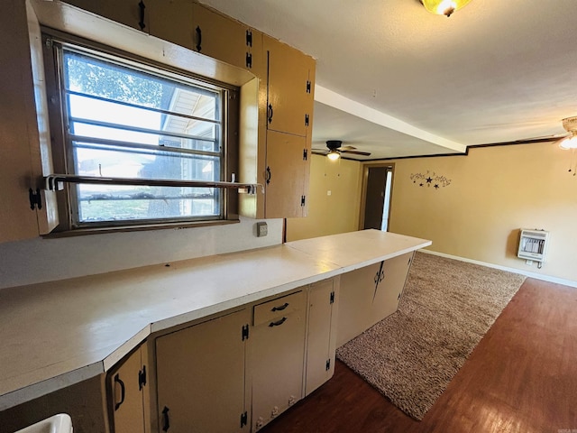 110 Saint Vincent St, Morrilton, AR 72110 - kitchen with ceiling fan, dark wood-style flooring, and heating unit