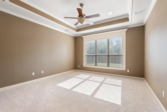 205 Lucia Ln, North Little Rock, AR 72113 - spare room featuring a tray ceiling, ornamental molding, light carpet, and a ceiling fan