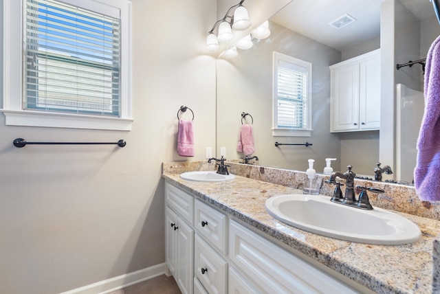 205 Lucia Ln, North Little Rock, AR 72113 - bathroom with double vanity and baseboards