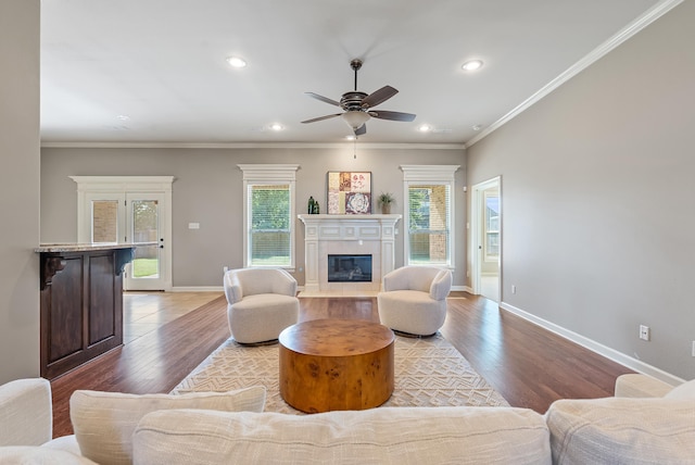 205 Lucia Ln, North Little Rock, AR 72113 - living room with light wood-style flooring, a glass covered fireplace, a ceiling fan, recessed lighting, and crown molding