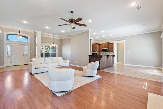 205 Lucia Ln, North Little Rock, AR 72113 - living area with a ceiling fan, a chandelier, crown molding, light wood finished floors, and recessed lighting