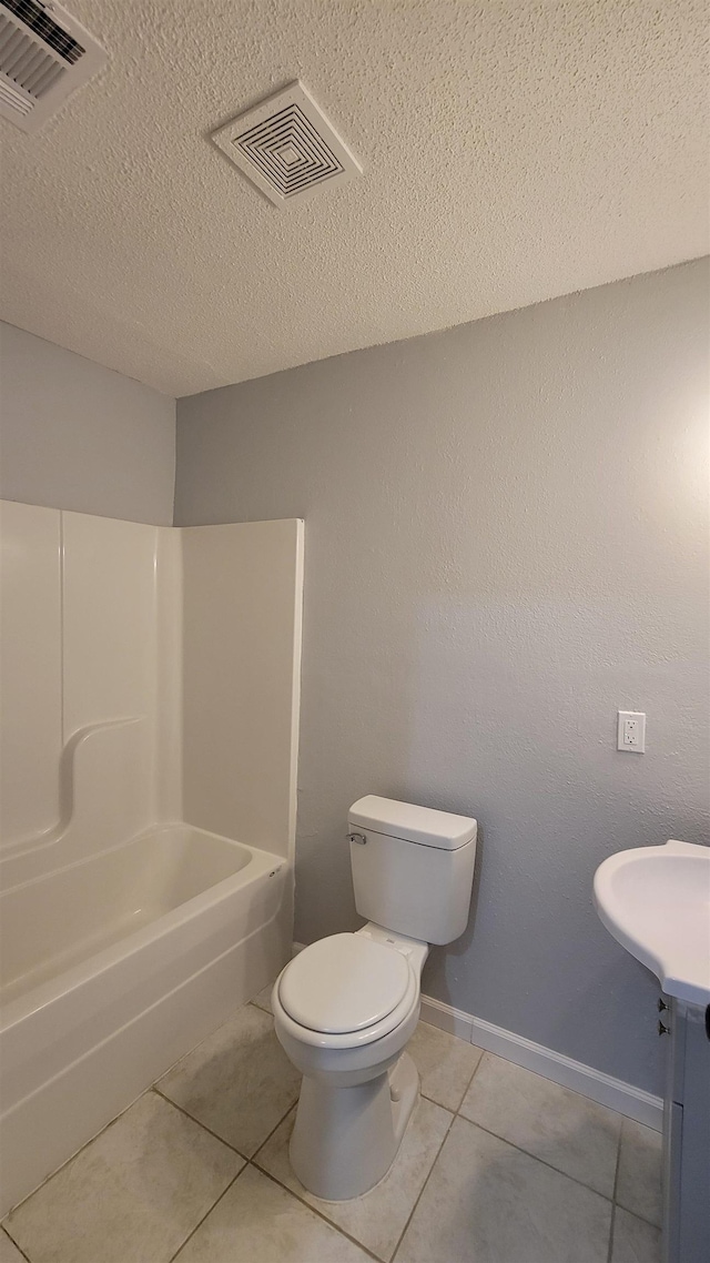705 Liberty, Marked Tree, AR 72365 - full bathroom with tile patterned flooring, washtub / shower combination, a textured ceiling, and vanity
