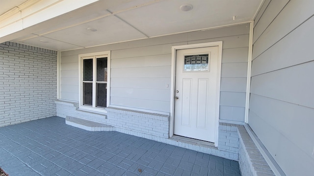 705 Liberty, Marked Tree, AR 72365 - view of exterior entry featuring brick siding