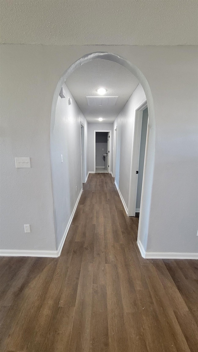 705 Liberty, Marked Tree, AR 72365 - hallway featuring dark wood finished floors and arched walkways
