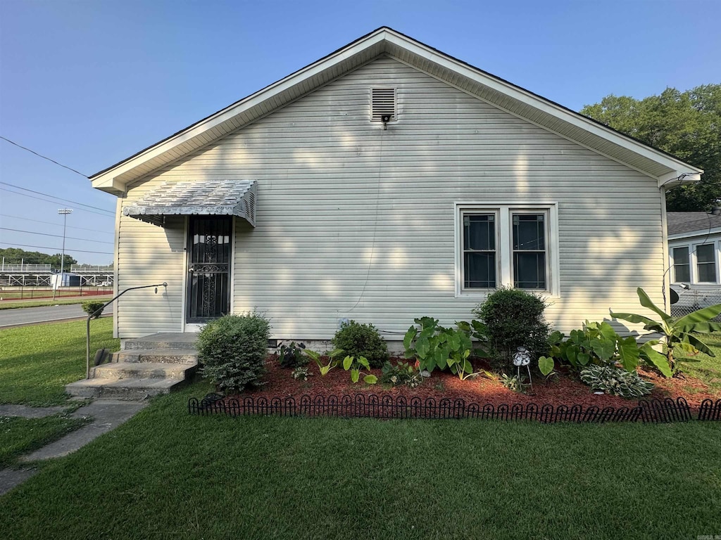 1031 Cherry, Forrest City, AR 72335 - view of side of property featuring a yard