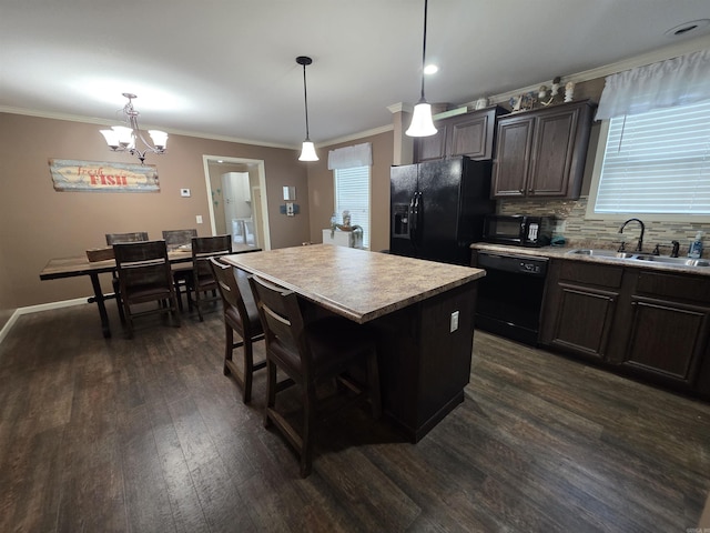 274 Hopewell Hollow Rd, Norfork, AR 72658 - kitchen featuring black appliances, dark wood finished floors, healthy amount of natural light, ornamental molding, and light countertops
