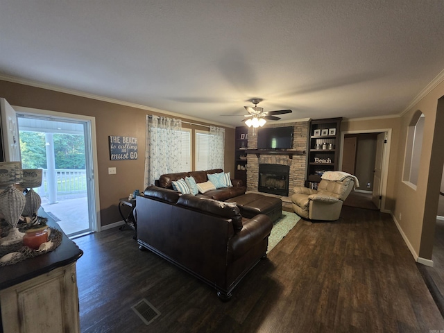 274 Hopewell Hollow Rd, Norfork, AR 72658 - living area featuring dark wood-type flooring, a fireplace, ornamental molding, and a ceiling fan