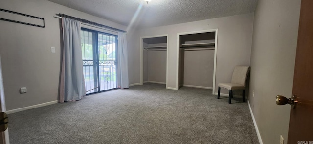 7309 Faulkner Lake Rd, North Little Rock, AR 72117 - unfurnished bedroom with carpet, multiple closets, a textured ceiling, and a wall mounted AC