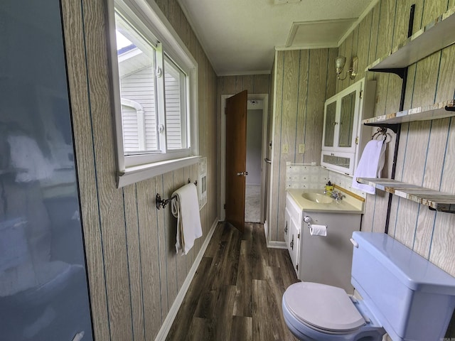 7309 Faulkner Lake Rd, North Little Rock, AR 72117 - bathroom with wood finished floors, vanity, wooden walls, and ornamental molding