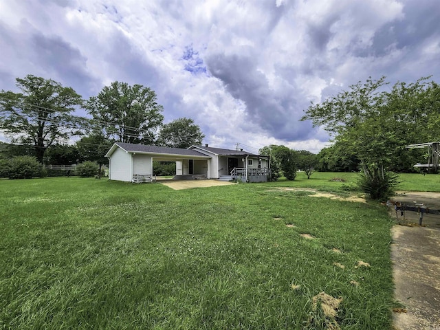 7309 Faulkner Lake Rd, North Little Rock, AR 72117 - view of grassy yard with a carport