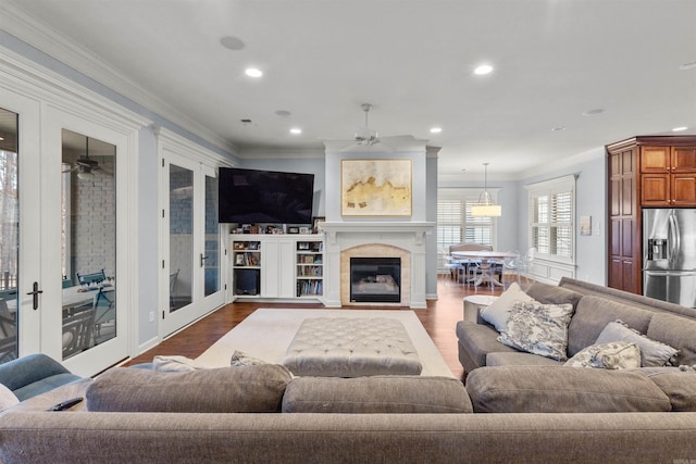 203 Miramar Blvd, Little Rock, AR 72223 - living area with a ceiling fan, ornamental molding, dark wood-type flooring, recessed lighting, and a fireplace with flush hearth