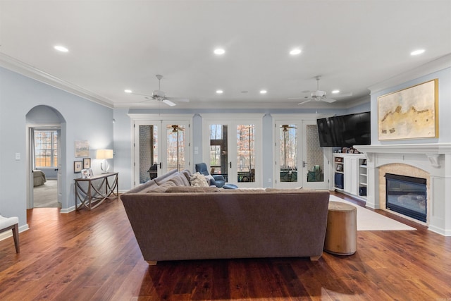 203 Miramar Blvd, Little Rock, AR 72223 - living room featuring a ceiling fan, a glass covered fireplace, healthy amount of natural light, crown molding, and recessed lighting