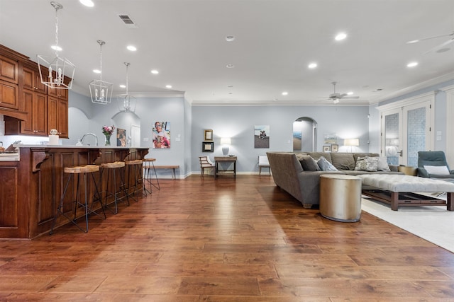 203 Miramar Blvd, Little Rock, AR 72223 - living room with a ceiling fan, ornamental molding, wood-type flooring, arched walkways, and recessed lighting