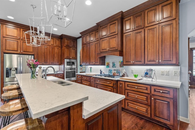 203 Miramar Blvd, Little Rock, AR 72223 - kitchen featuring appliances with stainless steel finishes, a chandelier, an island with sink, a breakfast bar area, and recessed lighting