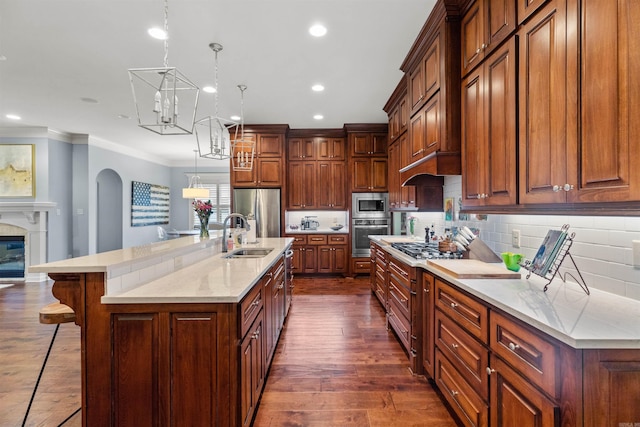 203 Miramar Blvd, Little Rock, AR 72223 - kitchen with ornamental molding, stainless steel appliances, a kitchen breakfast bar, recessed lighting, and decorative backsplash