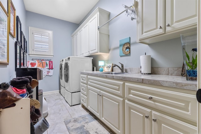 203 Miramar Blvd, Little Rock, AR 72223 - laundry area with independent washer and dryer, cabinet space, and light marble finish floors