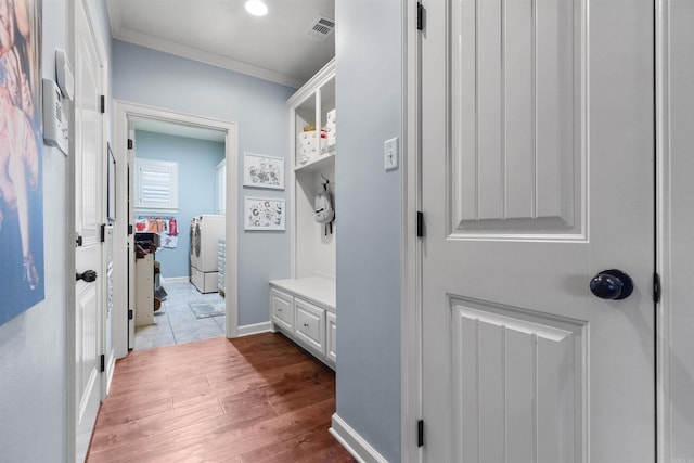 203 Miramar Blvd, Little Rock, AR 72223 - mudroom with washer / clothes dryer, ornamental molding, and dark wood-style floors