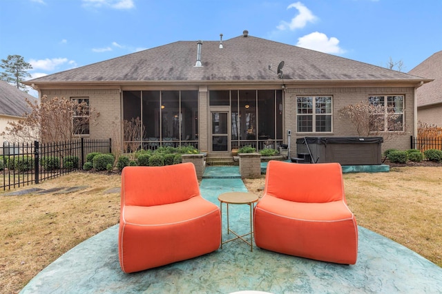 203 Miramar Blvd, Little Rock, AR 72223 - back of property featuring a hot tub, brick siding, a sunroom, a patio area, and a shingled roof