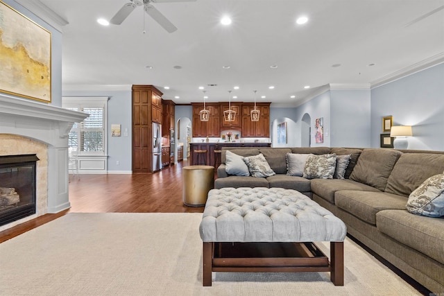 203 Miramar Blvd, Little Rock, AR 72223 - living room featuring wood finished floors, recessed lighting, ceiling fan, a glass covered fireplace, and crown molding