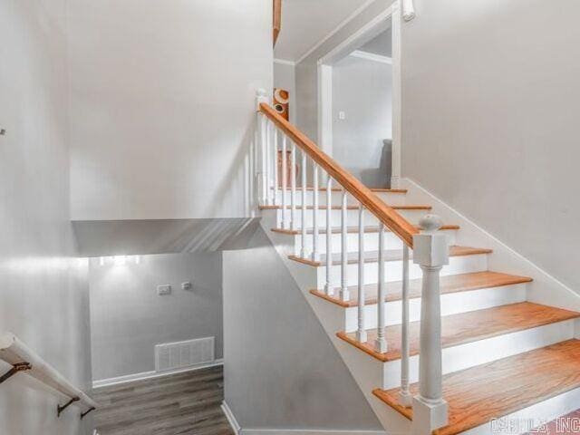 22 Nob Hill Cv, Little Rock, AR 72205 - staircase with wood finished floors and baseboards