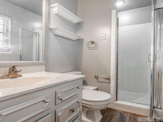 22 Nob Hill Cv, Little Rock, AR 72205 - full bathroom featuring vanity, a shower stall, and wood finished floors
