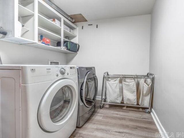 22 Nob Hill Cv, Little Rock, AR 72205 - laundry room with washer and clothes dryer and wood finished floors