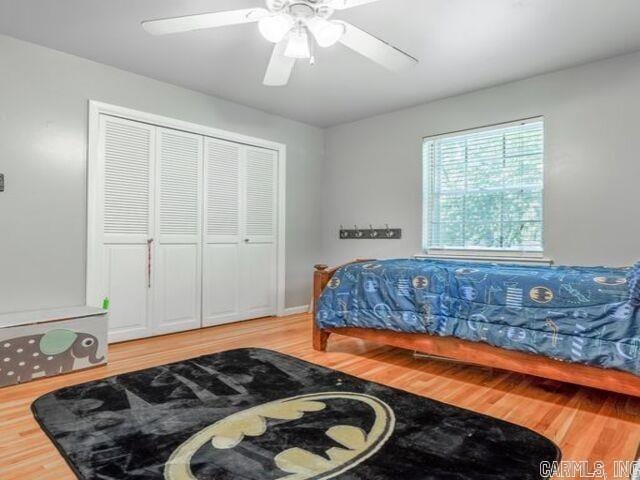 22 Nob Hill Cv, Little Rock, AR 72205 - bedroom with wood finished floors, a closet, and ceiling fan