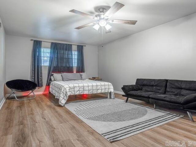 22 Nob Hill Cv, Little Rock, AR 72205 - bedroom with wood finished floors and a ceiling fan