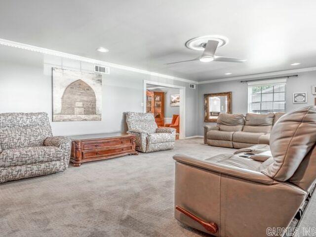 22 Nob Hill Cv, Little Rock, AR 72205 - carpeted living room featuring a ceiling fan and ornamental molding