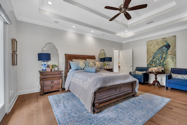 4260 Weldon Cv, Jonesboro, AR 72404 - bedroom featuring a tray ceiling, wood finished floors, crown molding, recessed lighting, and ceiling fan
