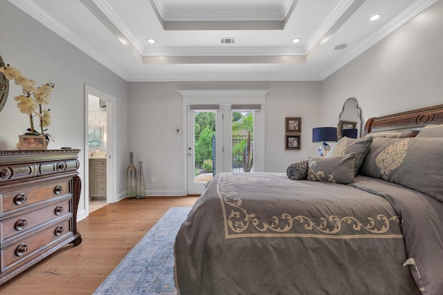 4260 Weldon Cv, Jonesboro, AR 72404 - bedroom featuring access to exterior, light wood finished floors, a raised ceiling, ensuite bathroom, and ornamental molding