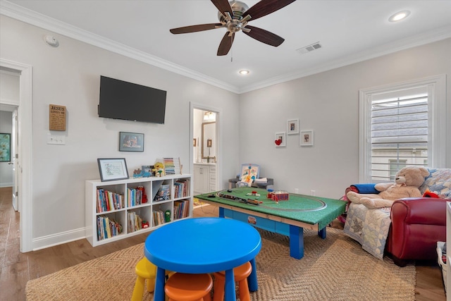 4260 Weldon Cv, Jonesboro, AR 72404 - playroom featuring wood finished floors, ceiling fan, crown molding, and recessed lighting