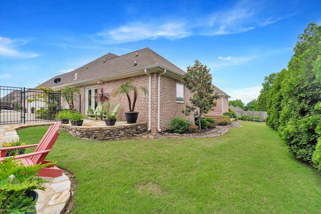 4260 Weldon Cv, Jonesboro, AR 72404 - back of house featuring brick siding, a patio, and a shingled roof