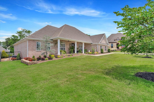 4260 Weldon Cv, Jonesboro, AR 72404 - view of front of home featuring brick siding, a shingled roof, and a ceiling fan