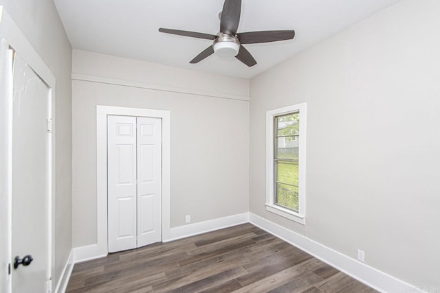 2708 Rock St, Little Rock, AR 72206 - unfurnished bedroom with dark wood-style floors, a closet, and ceiling fan