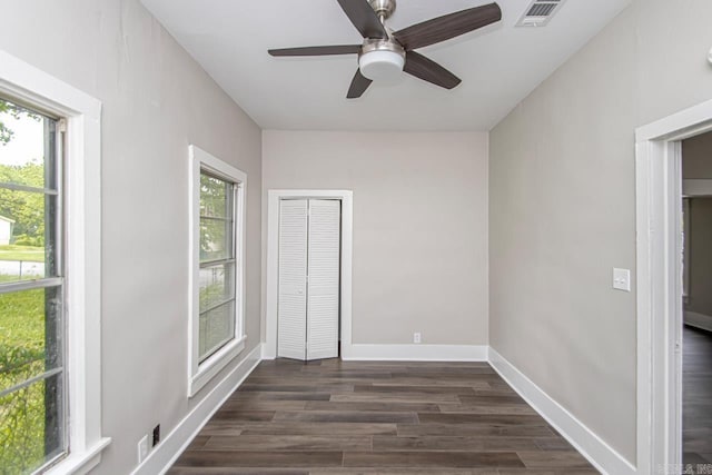 2708 Rock St, Little Rock, AR 72206 - unfurnished room featuring healthy amount of natural light, dark wood finished floors, and ceiling fan
