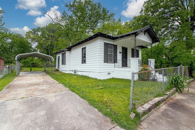 2708 Rock St, Little Rock, AR 72206 - view of side of property featuring crawl space, covered porch, a carport, and concrete driveway