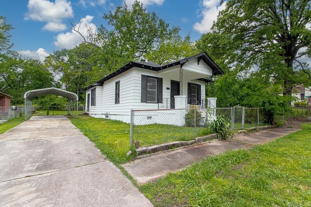 2708 Rock St, Little Rock, AR 72206 - shotgun-style home featuring a carport, crawl space, and a fenced front yard