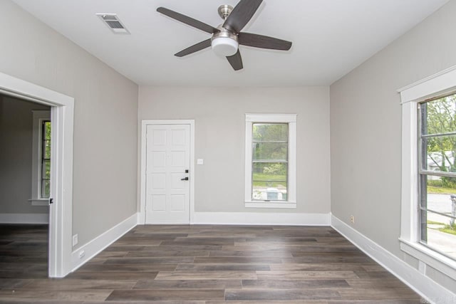 2708 Rock St, Little Rock, AR 72206 - spare room featuring healthy amount of natural light, a ceiling fan, and dark wood-type flooring