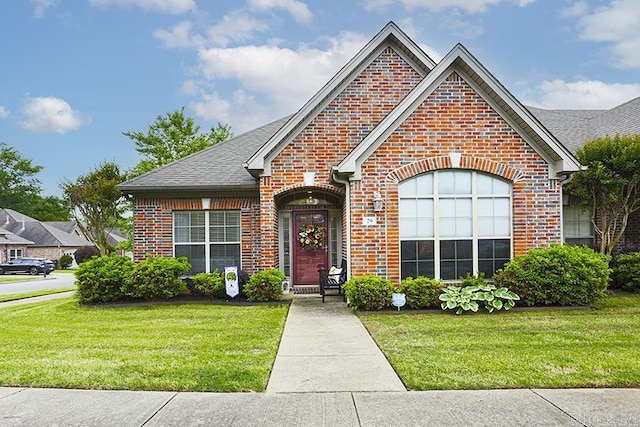 29 Taylor Park Loop, Little Rock, AR 72211 - view of front of home featuring brick siding, a front lawn, and a shingled roof