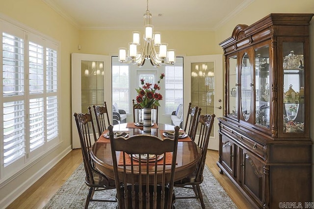 29 Taylor Park Loop, Little Rock, AR 72211 - dining area featuring a chandelier, light wood finished floors, and crown molding