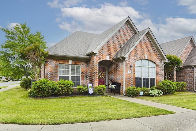 29 Taylor Park Loop, Little Rock, AR 72211 - view of front facade with brick siding, a front yard, and a shingled roof