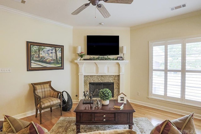 29 Taylor Park Loop, Little Rock, AR 72211 - living area with wood finished floors, ornamental molding, a ceiling fan, and a fireplace