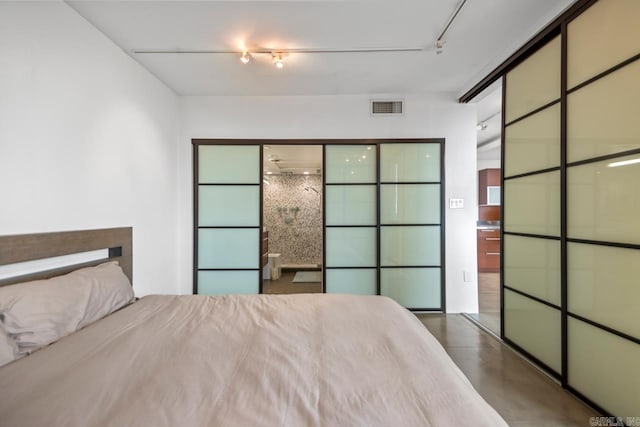 700 E 9th J St Unit 12J, Little Rock, AR 72202 - bedroom with track lighting