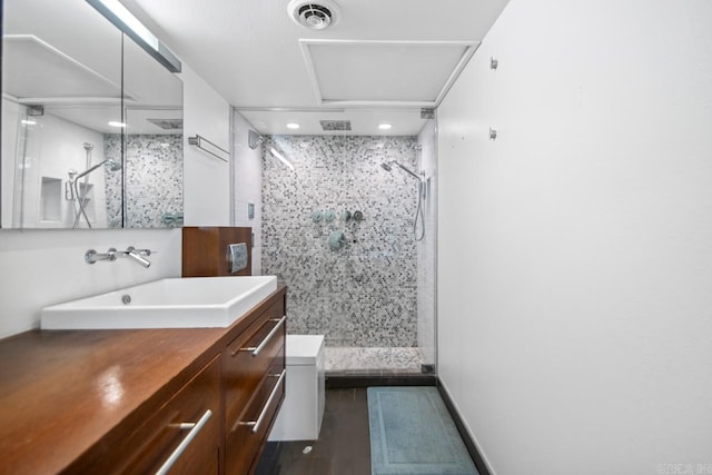 700 E 9th J St Unit 12J, Little Rock, AR 72202 - bathroom with vanity, a stall shower, and recessed lighting