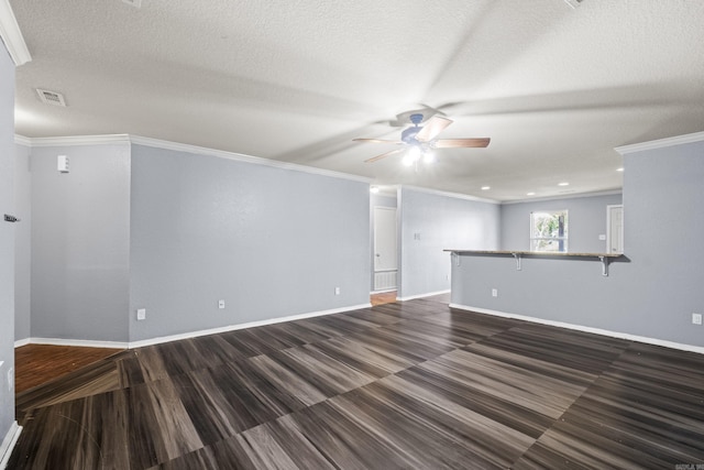 6532 Ridgemist Cv, North Little Rock, AR 72117 - unfurnished living room featuring a ceiling fan, ornamental molding, and a textured ceiling