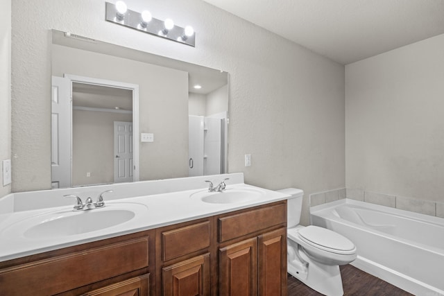 6532 Ridgemist Cv, North Little Rock, AR 72117 - full bathroom featuring double vanity, wood finished floors, a garden tub, and a shower