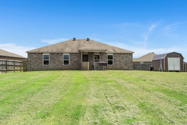 6532 Ridgemist Cv, North Little Rock, AR 72117 - back of property with a storage unit, brick siding, and roof with shingles