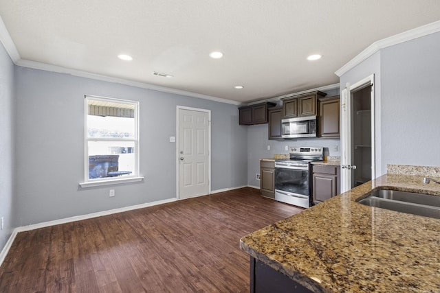 6532 Ridgemist Cv, North Little Rock, AR 72117 - kitchen featuring appliances with stainless steel finishes, dark wood-style flooring, ornamental molding, recessed lighting, and stone counters