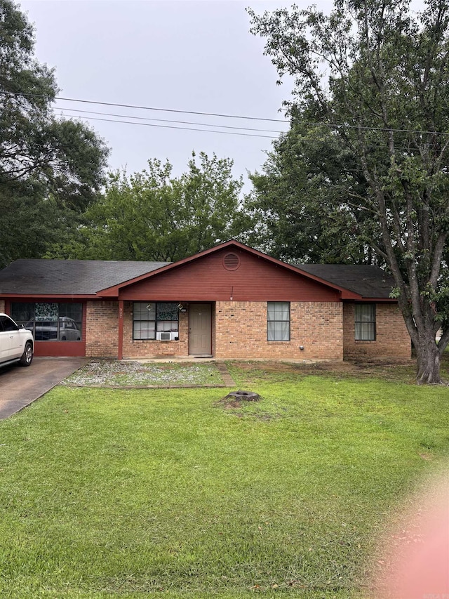 320 S Lewis St, Mineral Sprs, AR 71851 - single story home featuring a front lawn, brick siding, and driveway